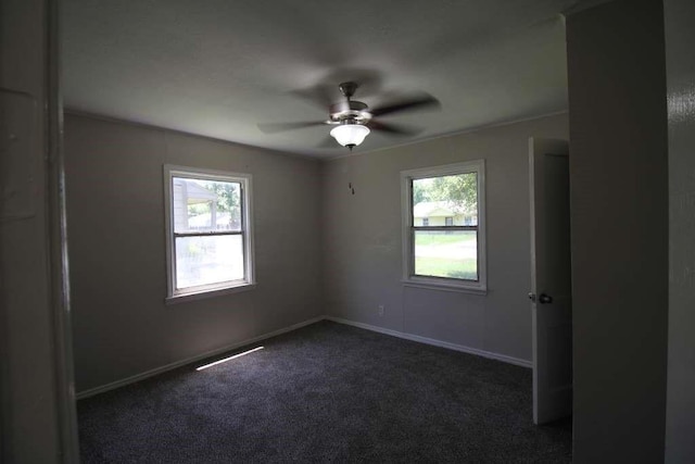 1507 Demaree Ln, Houston, TX 77029 - unfurnished room with dark carpet, a ceiling fan, and baseboards