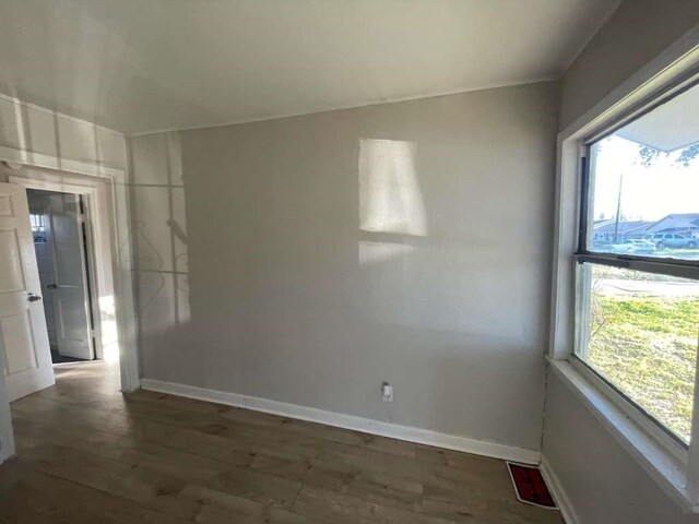 1507 Demaree Ln, Houston, TX 77029 - unfurnished room with plenty of natural light, wood finished floors, and baseboards