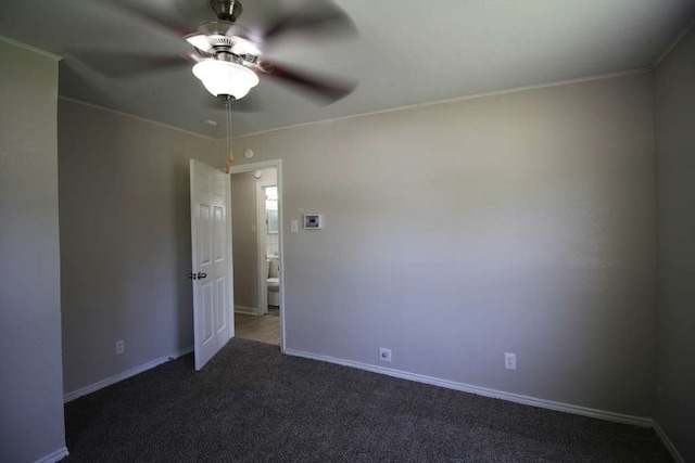 empty room featuring carpet flooring, ceiling fan, and ornamental molding