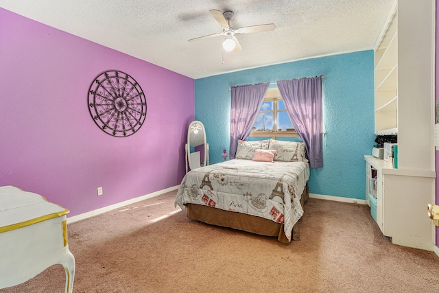 carpeted bedroom featuring a textured ceiling and ceiling fan