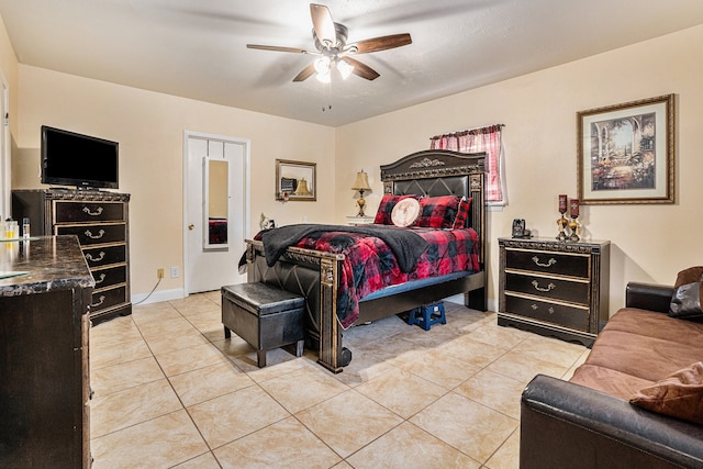 tiled bedroom with ceiling fan