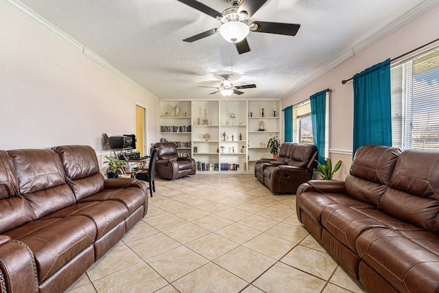 living room featuring a wealth of natural light, ceiling fan, and a textured ceiling