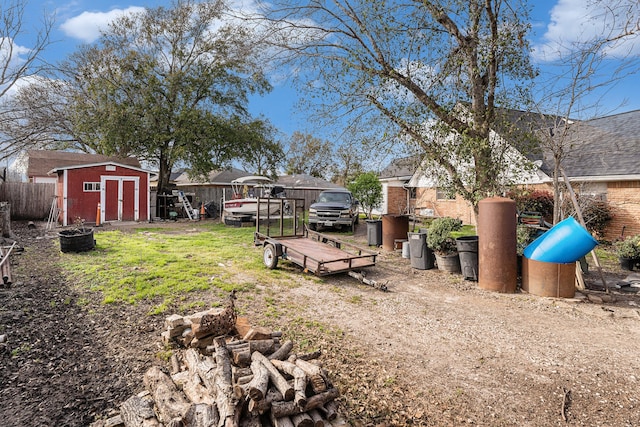 view of yard featuring a storage unit