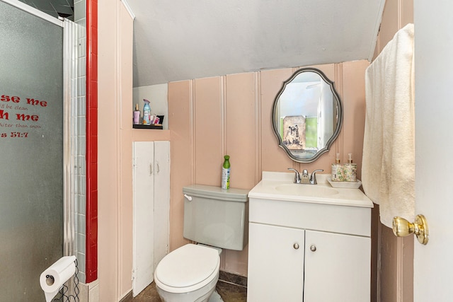 bathroom with toilet, a shower with door, and vanity