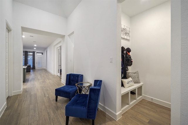 hall with wood-type flooring