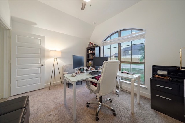 office space featuring light carpet, vaulted ceiling, and ceiling fan