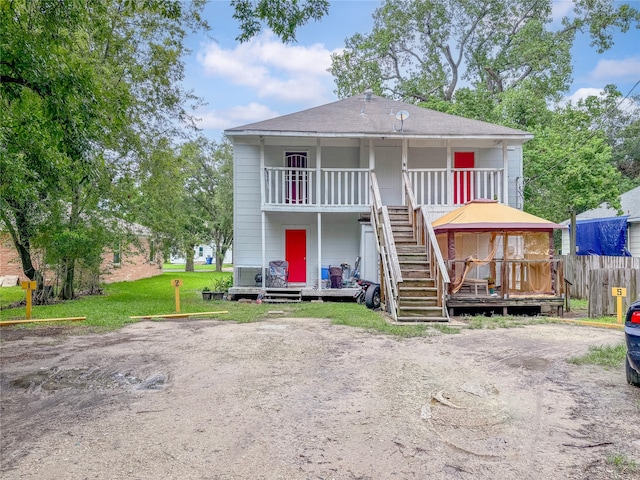 back of house with a yard