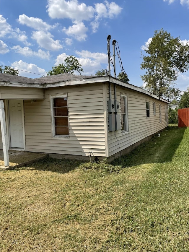 view of home's exterior featuring a yard