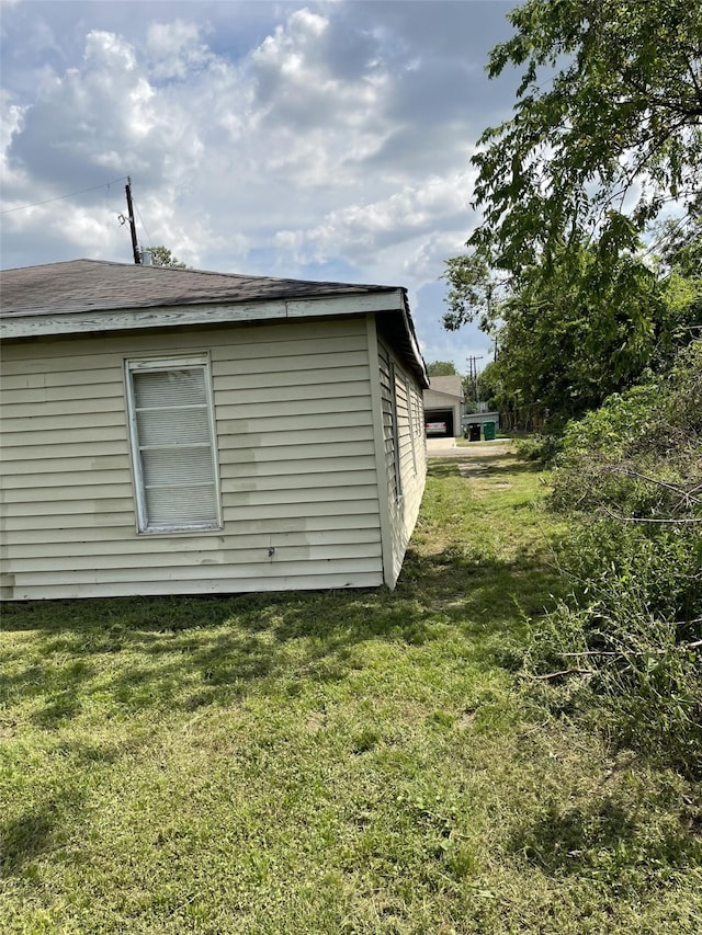 view of property exterior with a lawn