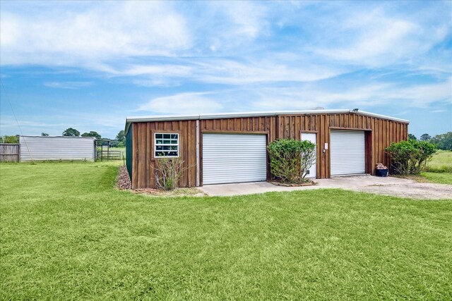 garage with a lawn