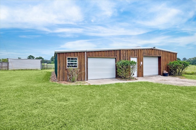 garage featuring a yard