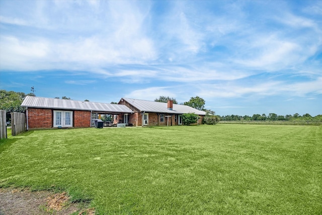 view of yard featuring french doors