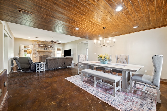 dining area featuring a stone fireplace, wooden ceiling, and ceiling fan with notable chandelier