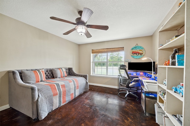 bedroom with ceiling fan and a textured ceiling