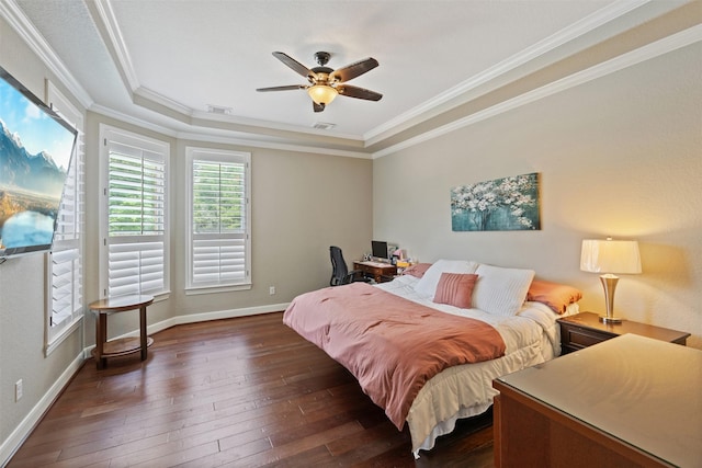 bedroom with dark wood finished floors, baseboards, visible vents, and ornamental molding