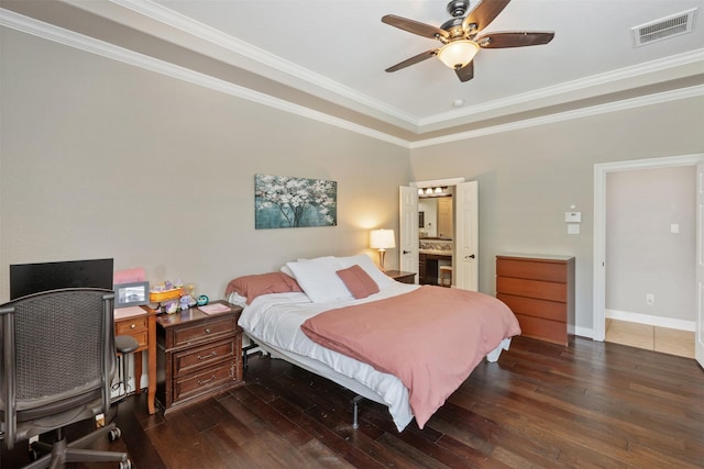 bedroom featuring baseboards, visible vents, ceiling fan, ornamental molding, and wood-type flooring