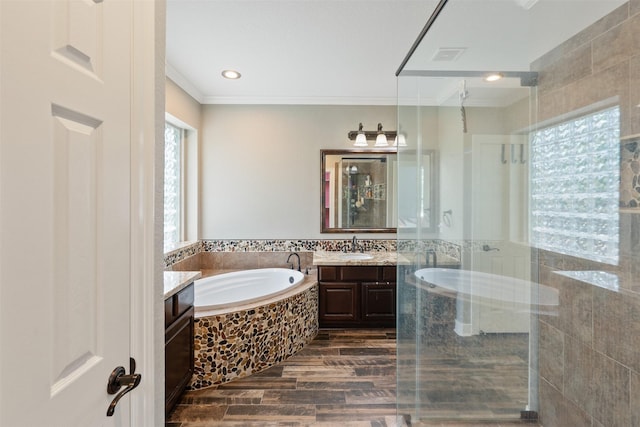 bathroom with visible vents, tile walls, a garden tub, a stall shower, and vanity