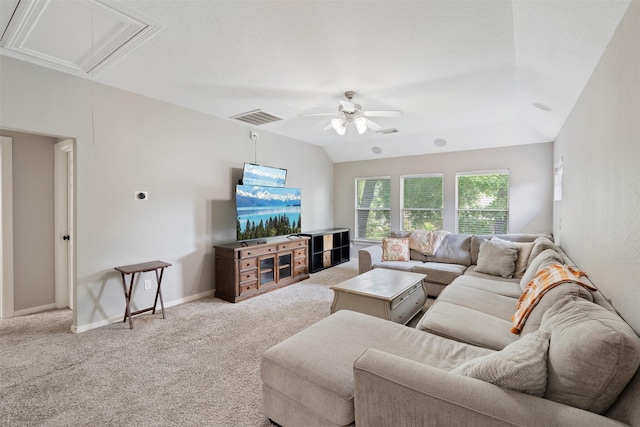 living room with visible vents, carpet floors, attic access, lofted ceiling, and ceiling fan