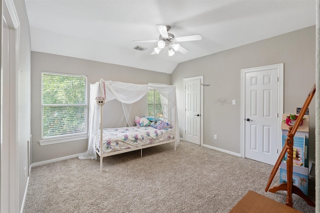 bedroom featuring visible vents, ceiling fan, baseboards, carpet, and lofted ceiling