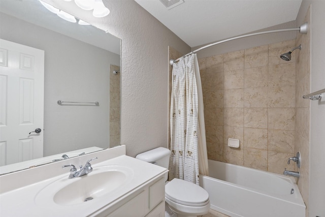 bathroom featuring vanity, toilet, shower / bath combo with shower curtain, and a textured wall