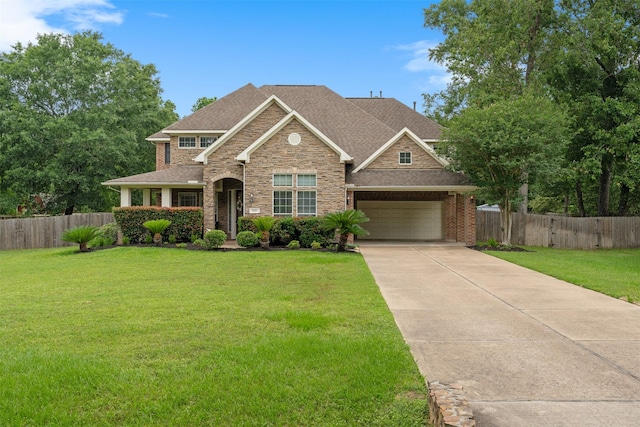 craftsman house featuring a front lawn and fence