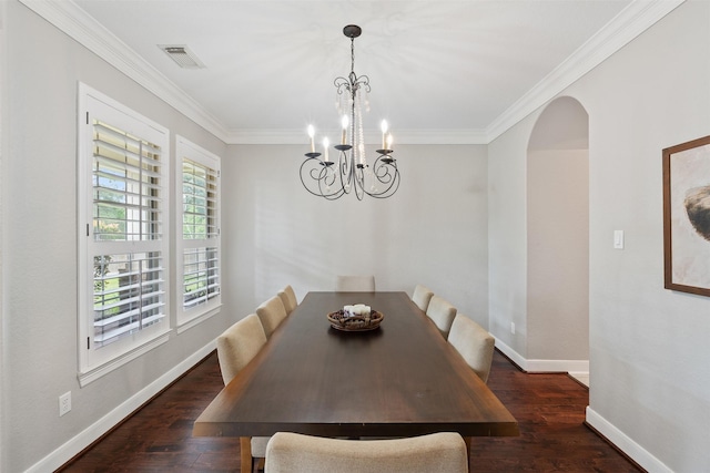 dining room featuring wood finished floors, visible vents, baseboards, arched walkways, and a notable chandelier