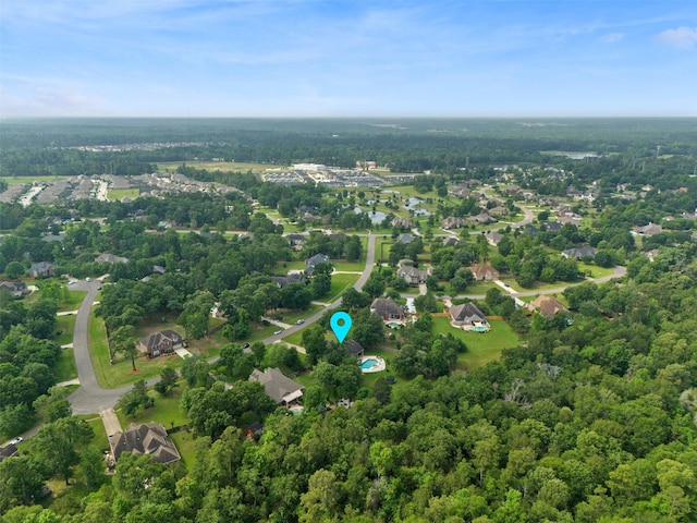 aerial view featuring a wooded view