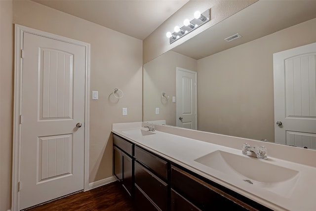 bathroom featuring hardwood / wood-style flooring and vanity