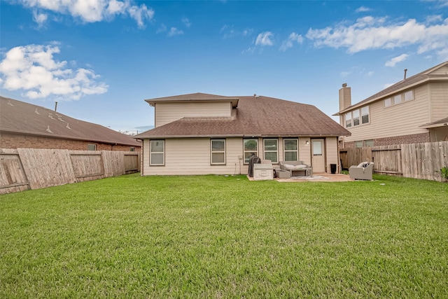 back of property featuring a patio area, a fenced backyard, and a yard