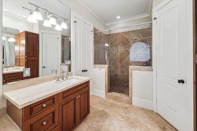 bathroom featuring ornamental molding, vanity, and a shower with door