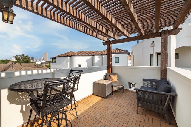 view of patio featuring a pergola and a bar