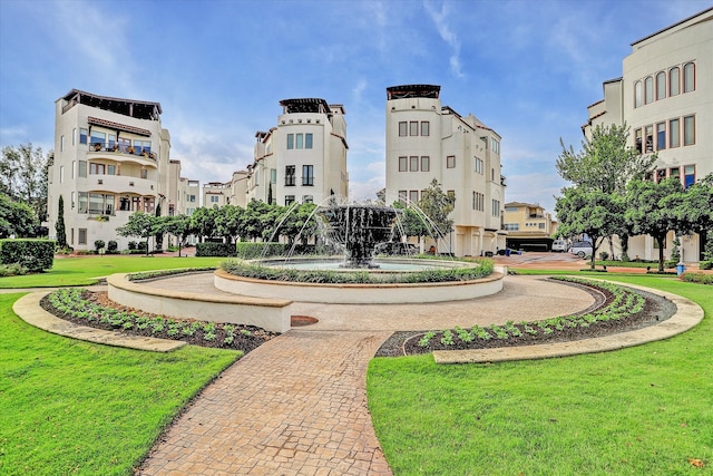 view of property's community featuring a yard