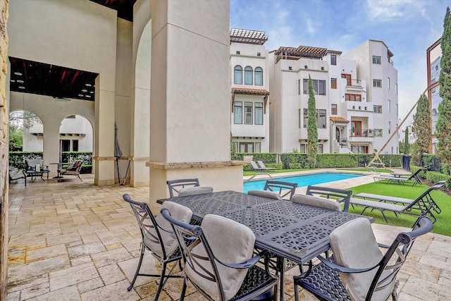 view of patio / terrace featuring a community pool