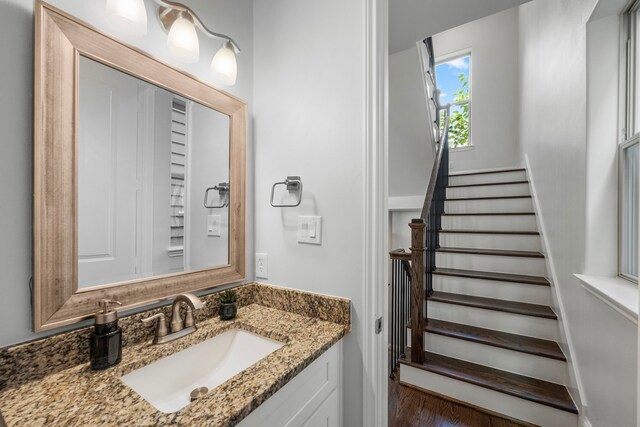 bathroom featuring hardwood / wood-style floors and vanity