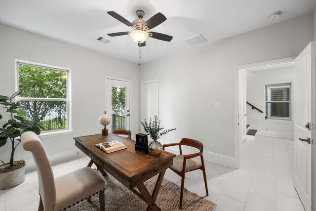 tiled office featuring ceiling fan