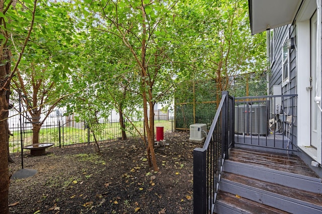 view of yard featuring central AC unit