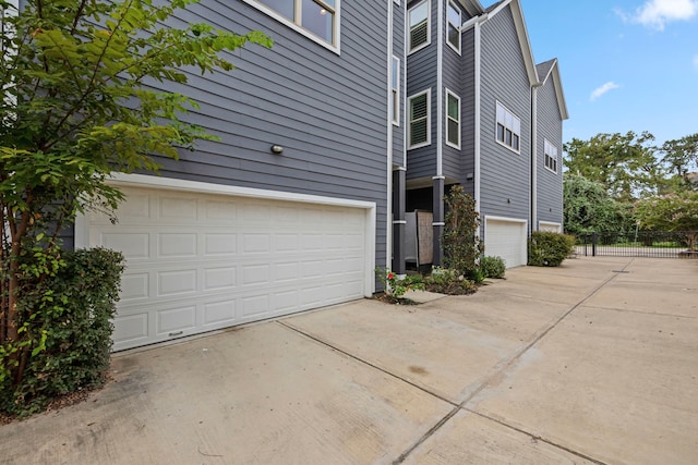 view of side of home with a garage