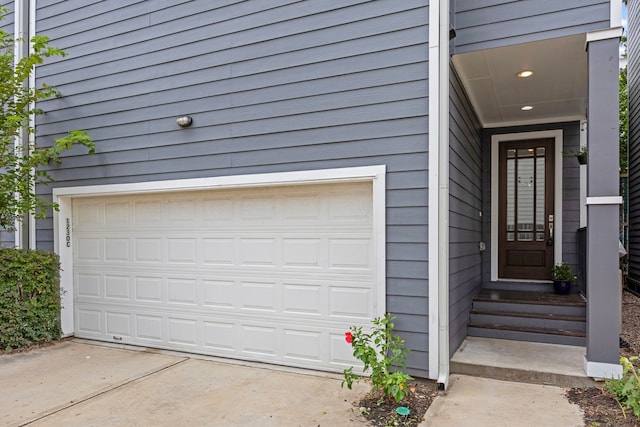 view of exterior entry featuring a garage