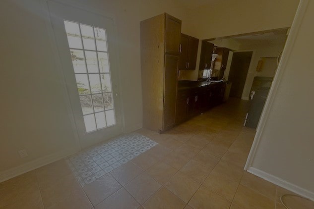 interior space with light tile patterned floors