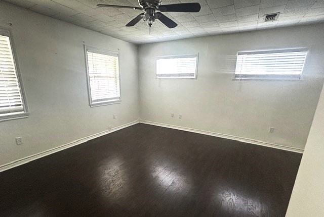 spare room with wood-type flooring and ceiling fan