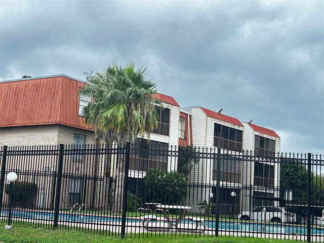 exterior space featuring a community pool