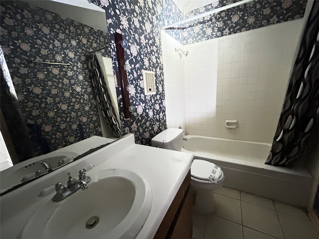 full bathroom featuring shower / bath combo with shower curtain, tile patterned flooring, toilet, and vanity