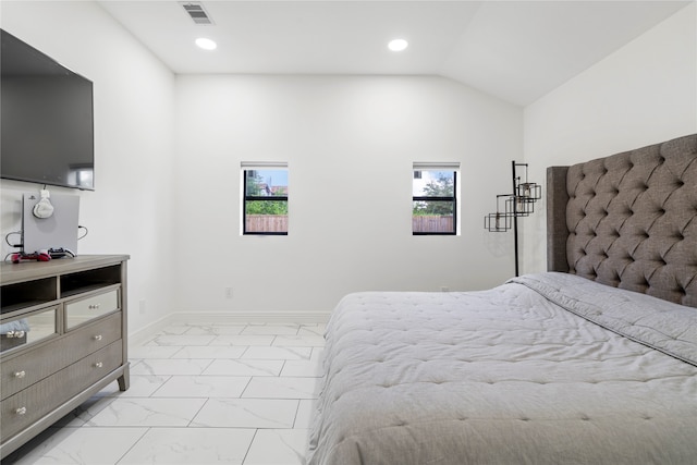 bedroom featuring lofted ceiling