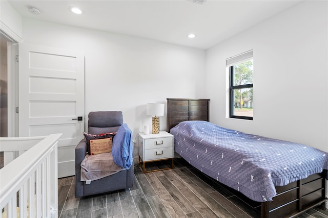 bedroom featuring dark hardwood / wood-style flooring