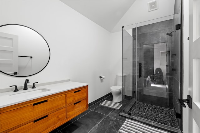 bathroom featuring lofted ceiling, walk in shower, toilet, and vanity