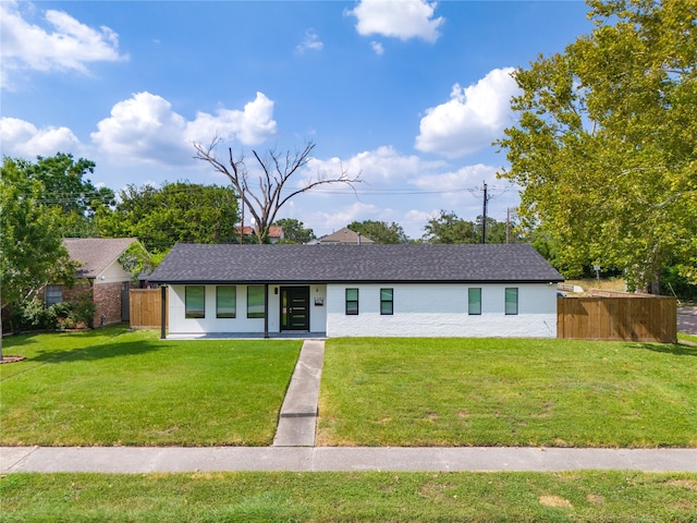 ranch-style house with a front yard