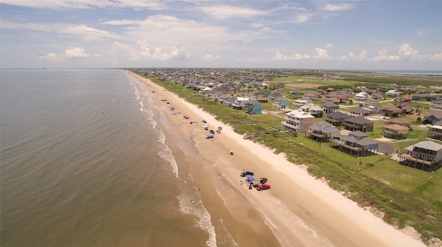 drone / aerial view with a beach view and a water view