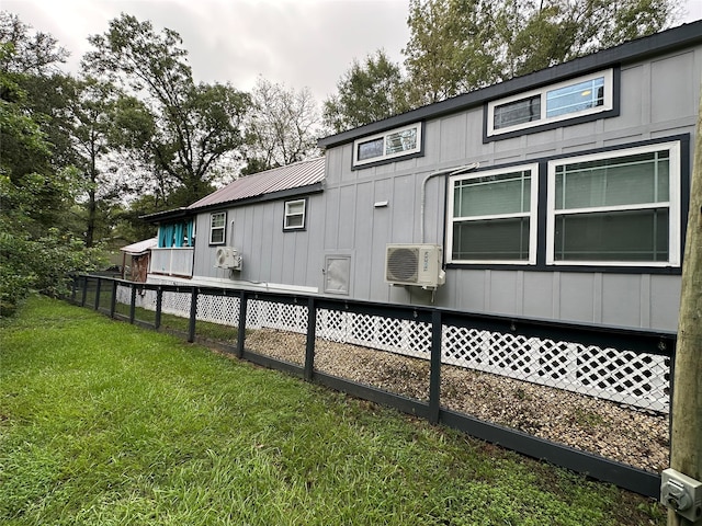 view of property exterior featuring a yard and ac unit