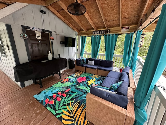 living room featuring hardwood / wood-style flooring and lofted ceiling with beams