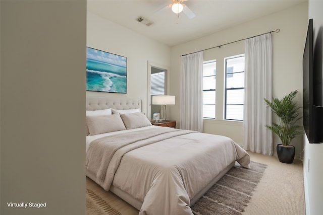 carpeted bedroom featuring ceiling fan